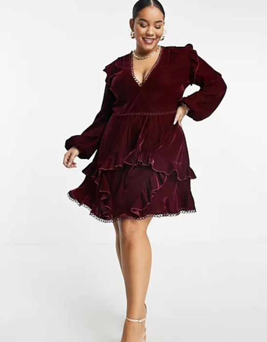 A model modeling a burgundy dress