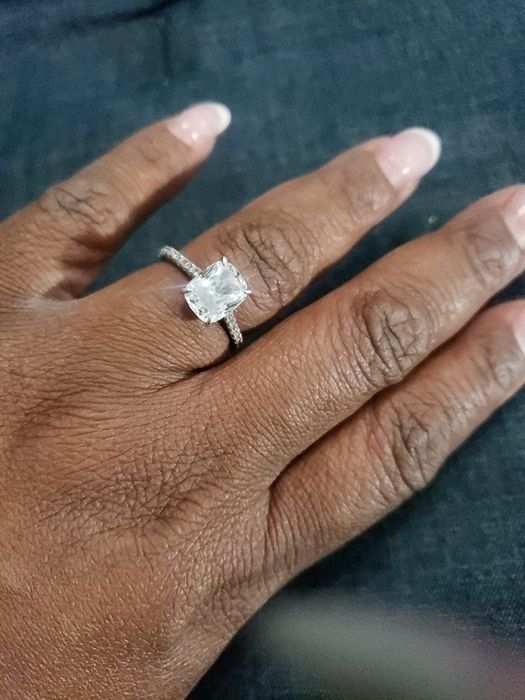 Another reviewer is seen wearing the ring, showcasing its elegant design.