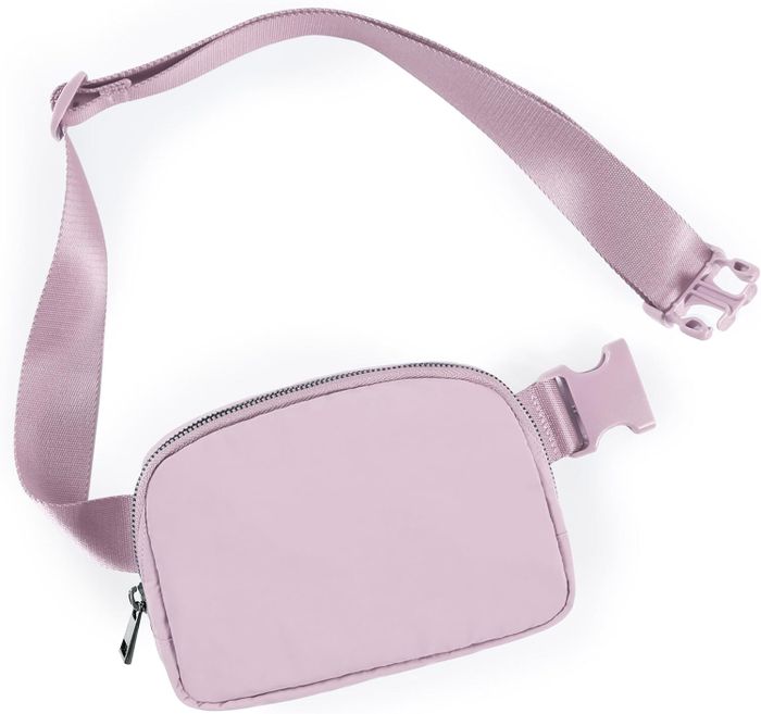A sleek, compact crossbody bag featuring an adjustable strap and a front zipper closure.