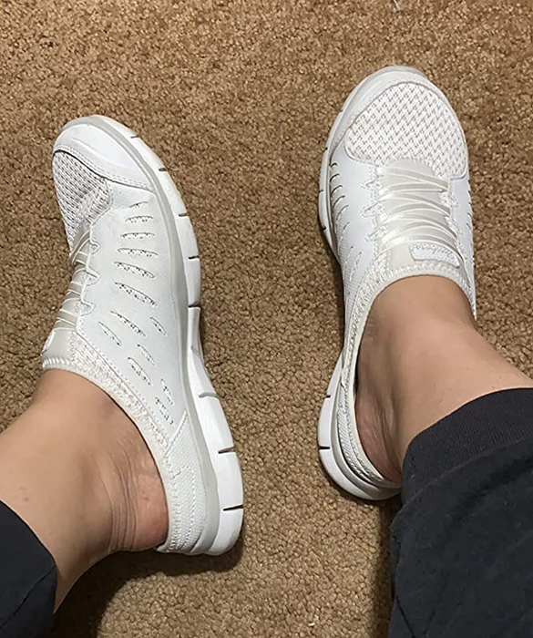 Reviewer sporting a pair of white sneakers.