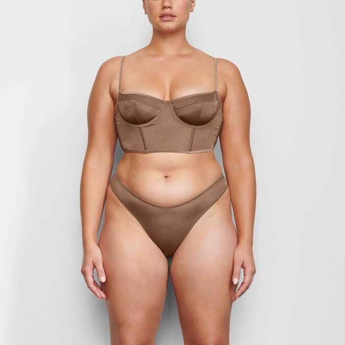 A model wears a corset and matching panties.