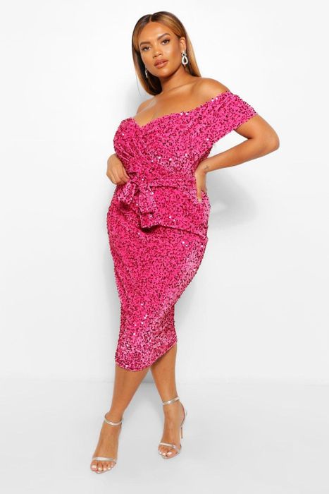 A model showcases a dazzling sequin pink dress.