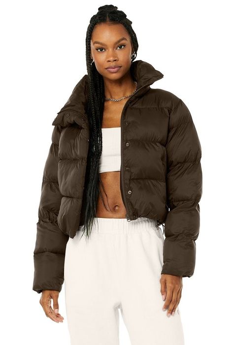 Model donning a brown coat