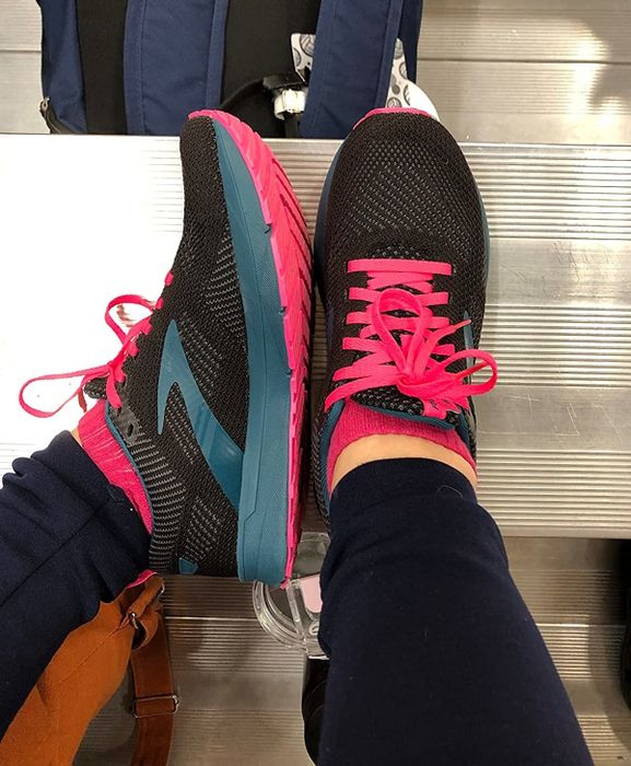 Image of a reviewer wearing black shoes