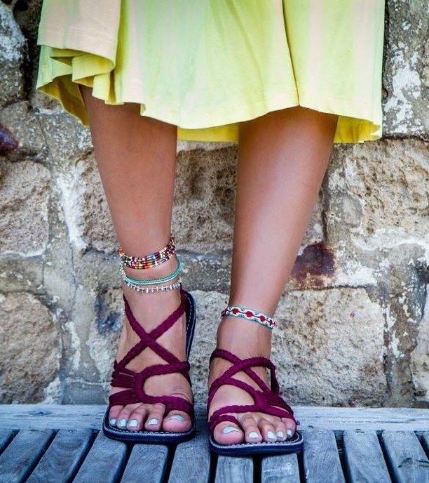 Model showcasing sandals in sunset sangria
