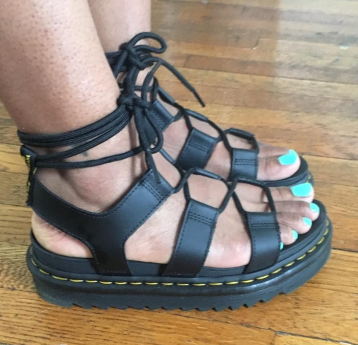 A reviewer's photo of them wearing the sandals while standing.