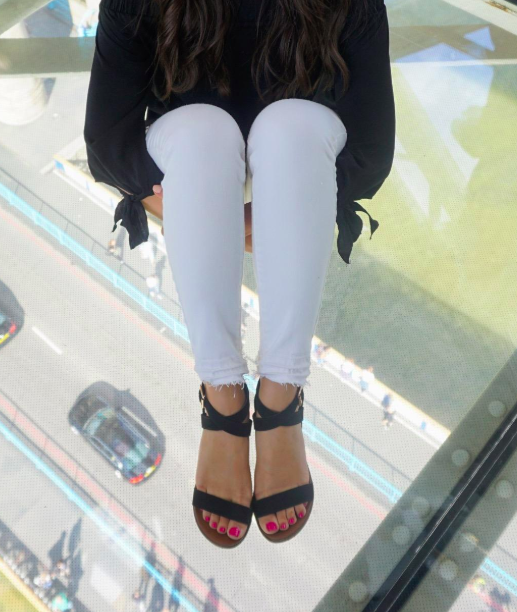 Reviewer wearing black sandals