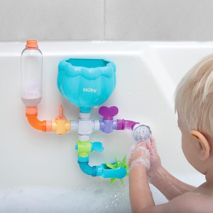 A bathtub water toy featuring pipes and showerheads
