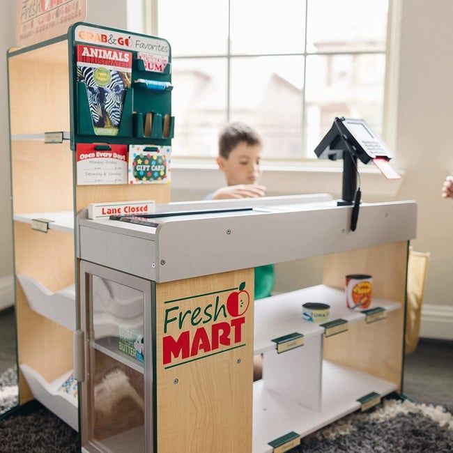 A wooden pretend grocery store set