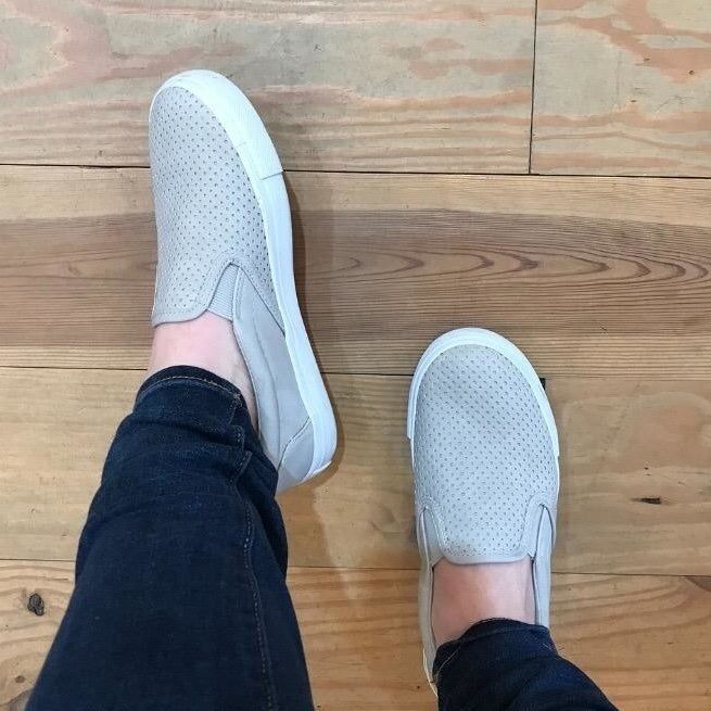 Reviewer modeling taupe-colored shoes