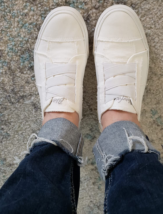 Reviewer sporting the white slip-ons.