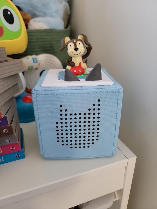 a puppy figurine placed on top of a Toniebox