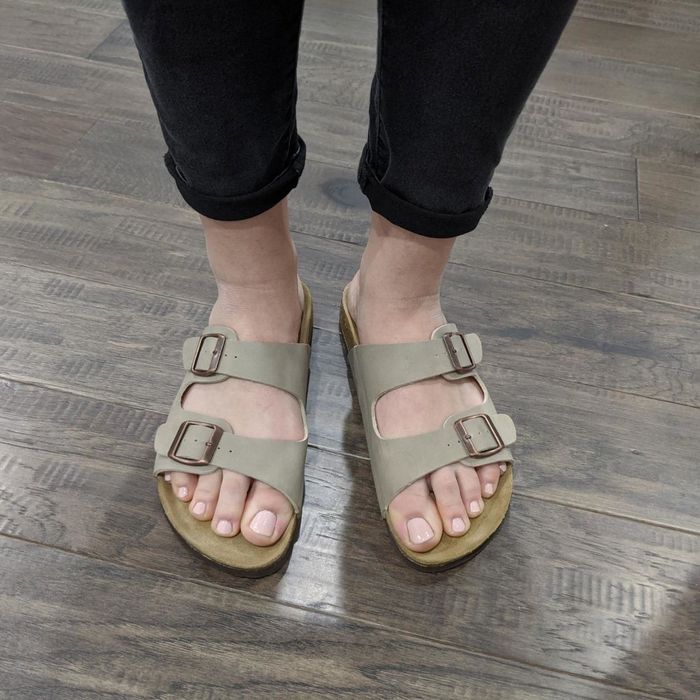 Reviewer wearing sandals with a cork footbed
