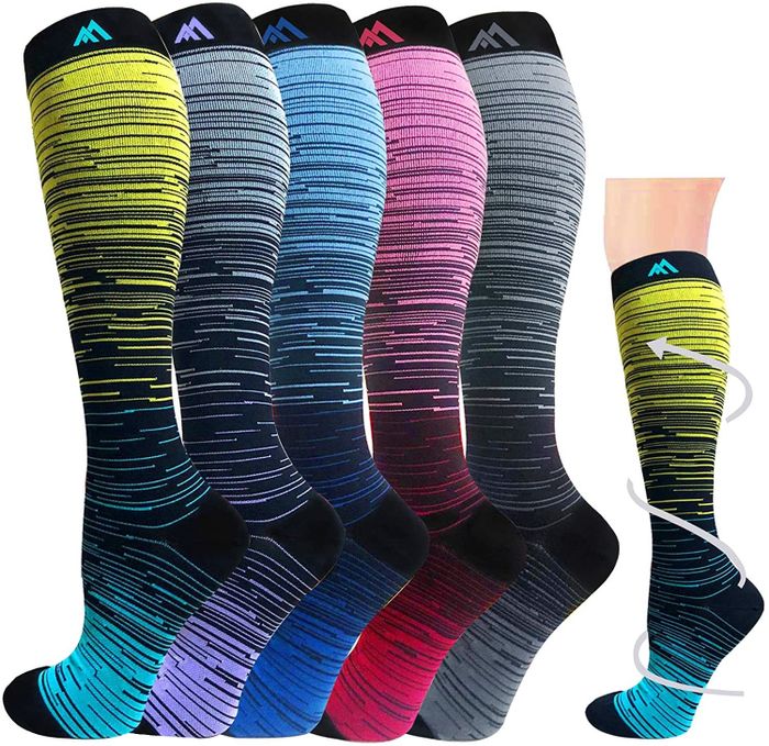 five knee-high compression socks, each in a different color