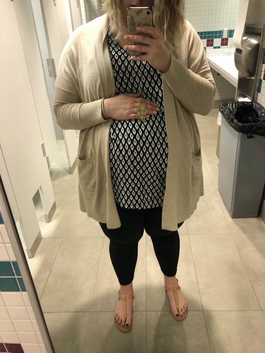 reviewer wearing leggings paired with a tunic top and a long cardigan