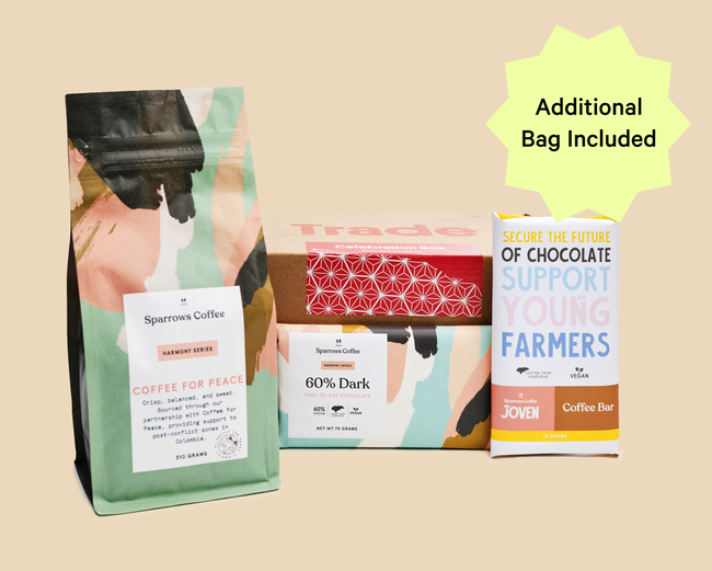 A gift box containing chocolate bars and a bag of coffee