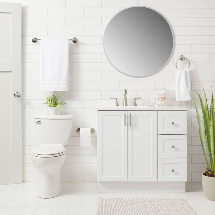 The brushed nickel hardware set displayed in a bathroom