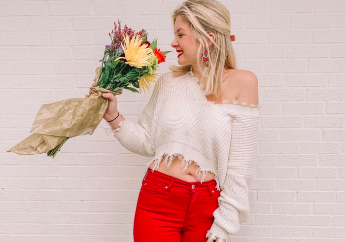 Another reviewer flaunting the cropped sweater in a fresh white shade.