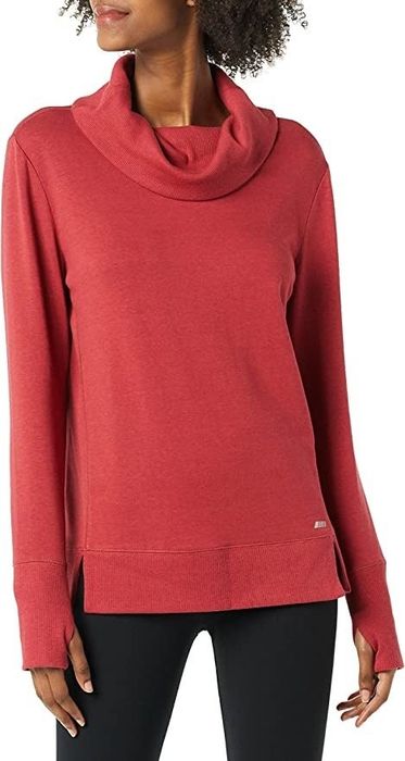 A model showcases the sweatshirt in a vibrant red hue.