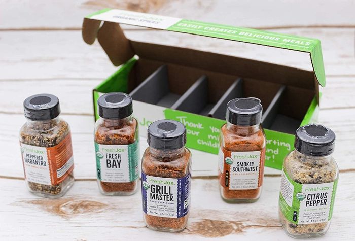 The box containing five different seasonings