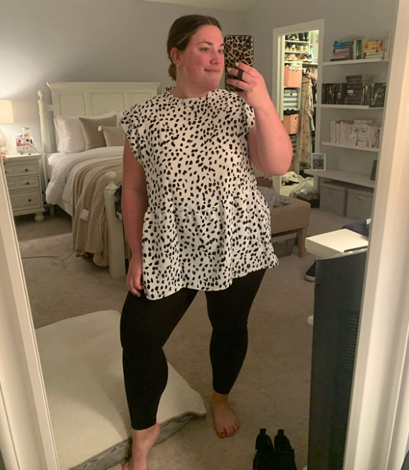 A customer review photo featuring the blouse in the 2111 Black color