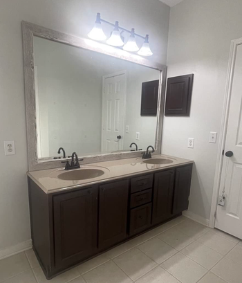 a reviewer's before photo displaying an outdated bathroom vanity