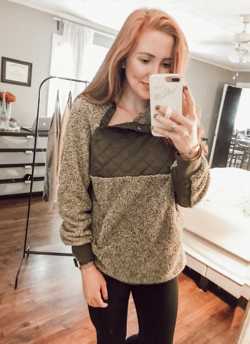 another reviewer rocking the brown version of the sweater