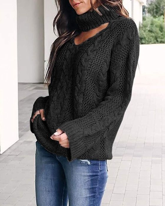 A model showcasing the black sweater