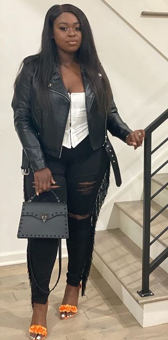 A customer's review photo of themselves wearing the white top