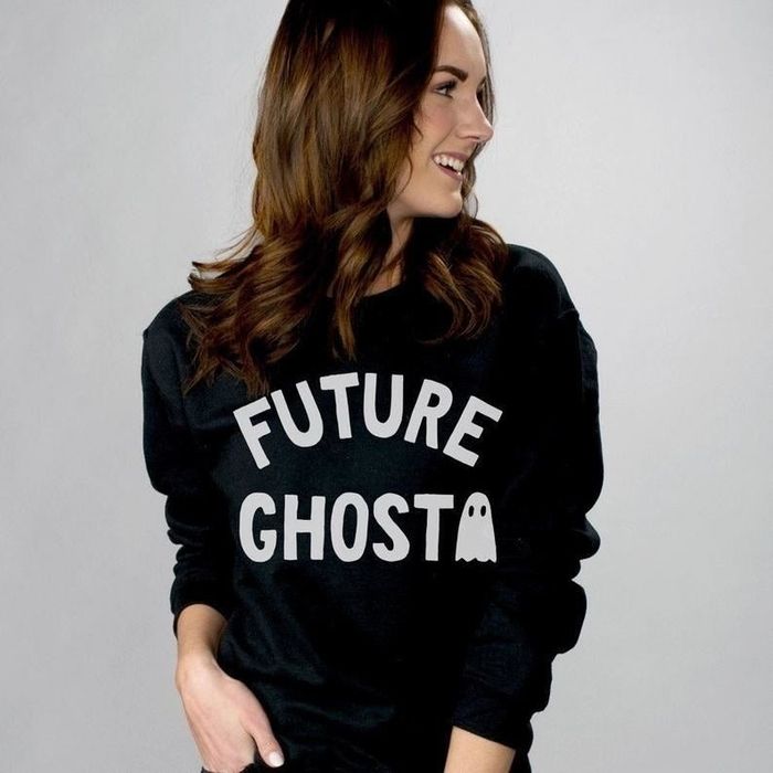 a model wearing a black crewneck sweatshirt with
