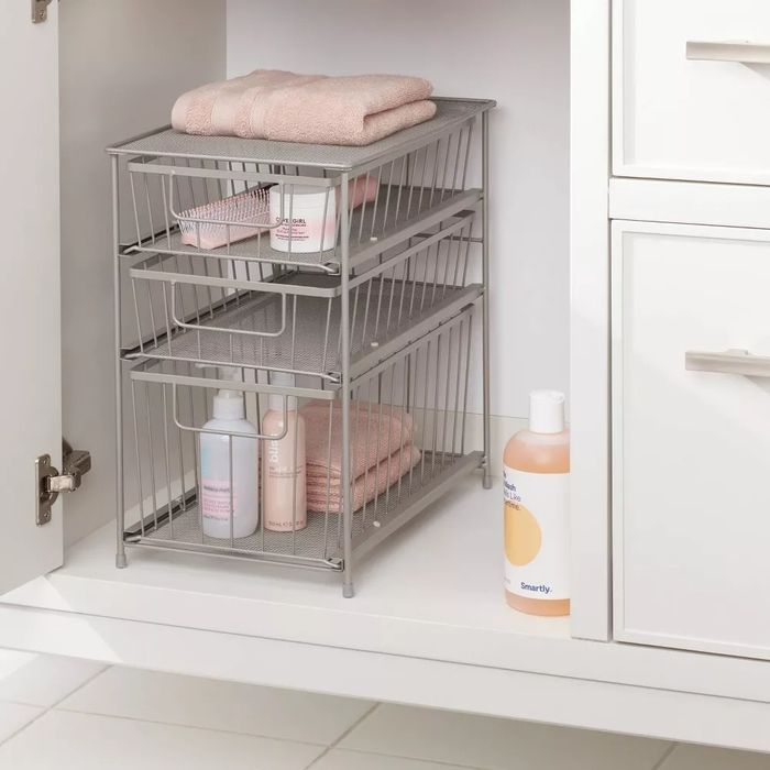 the sliding drawers inside a bathroom cabinet