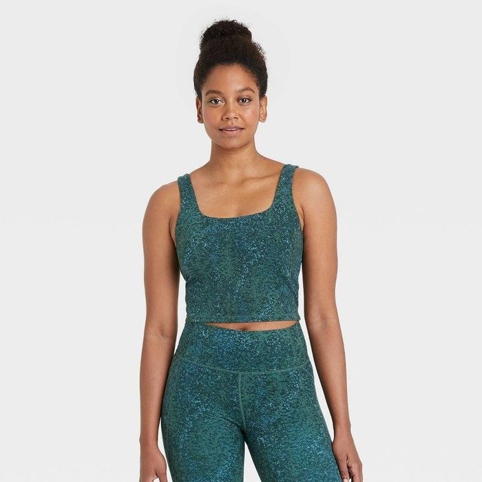 Model wearing the dark green longline sports bra