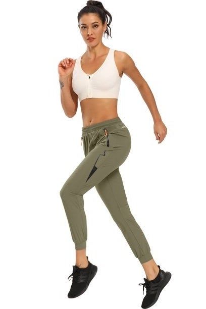 A model jogging in green pants