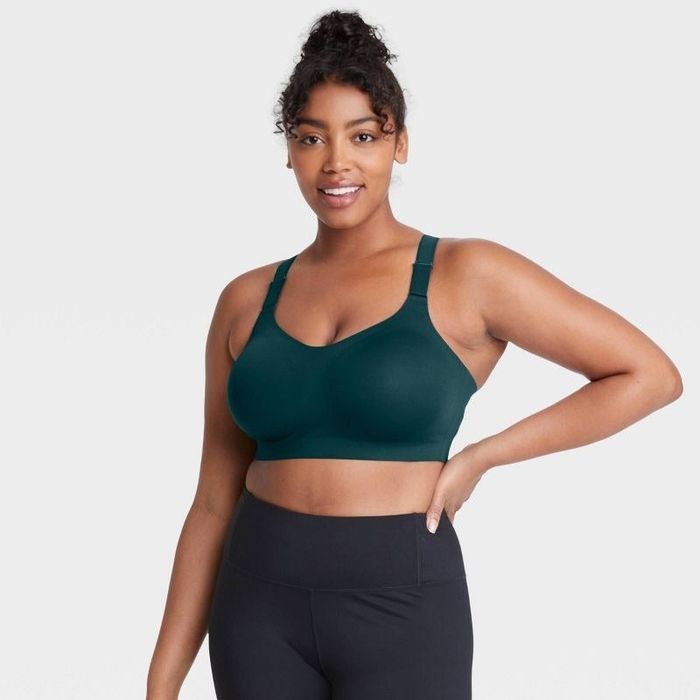 Model showcasing the navy teal high-support bonded sports bra