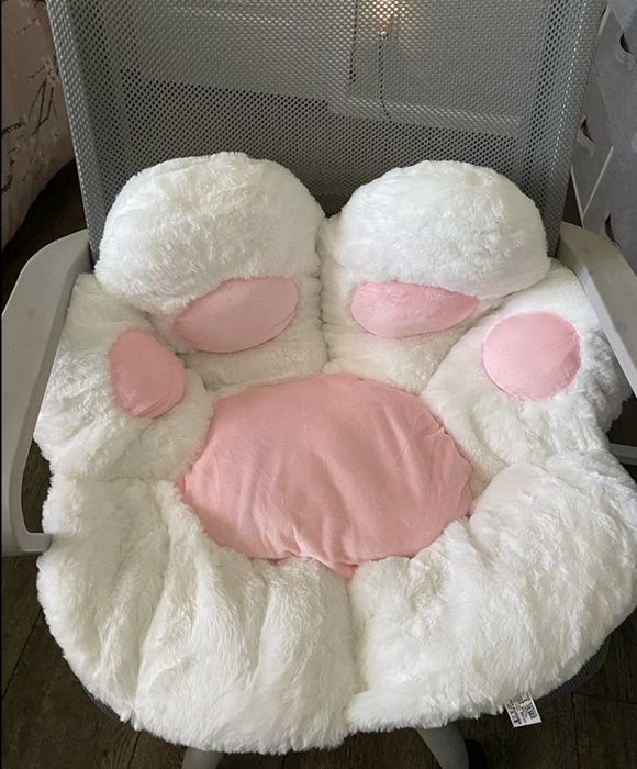 The cushion placed on a reviewer’s desk chair, offering extra comfort while working from home.
