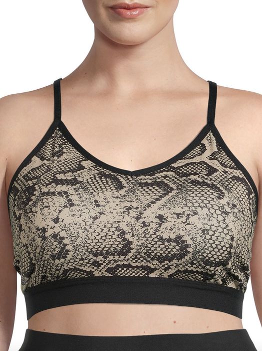 A person rocking a snake-skin-inspired racerback bra