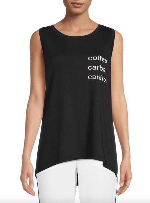 A person wearing a black tank top paired with white pants
