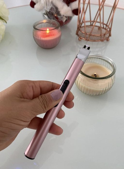 a person using the electric lighter