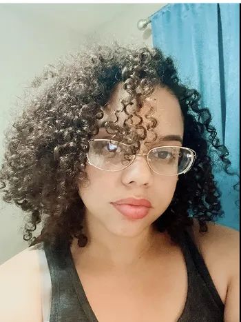 a reviewer displaying their hair's condition prior to applying the hair mask