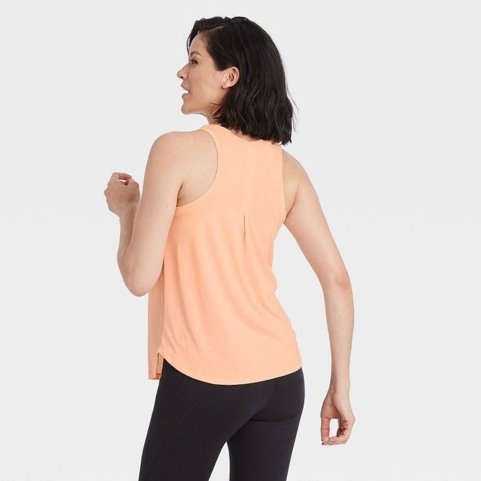 Model showcasing the peach active tank top