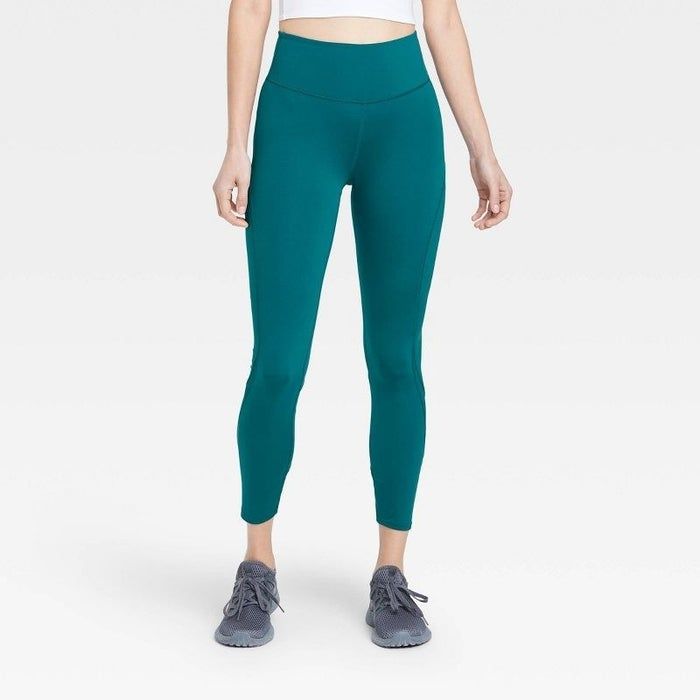 Model showcasing the eye-catching blue sculpt leggings