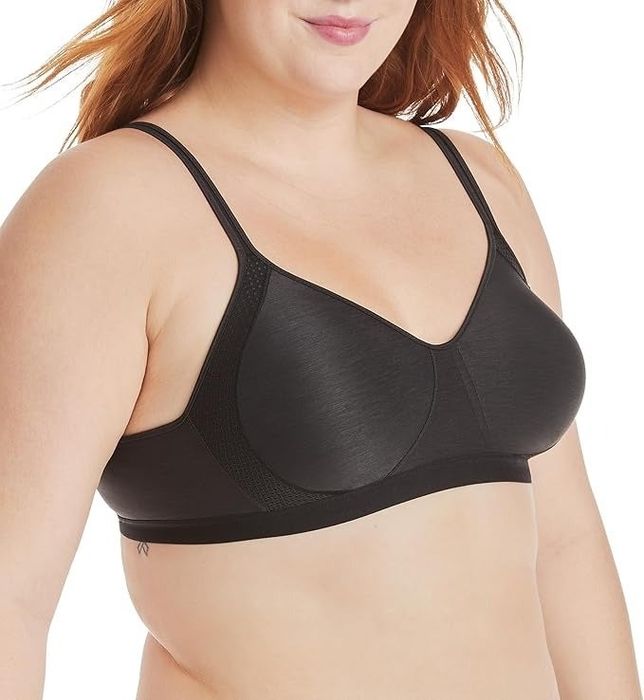 A model showcasing a black wireless bra, featuring a smooth and comfortable design perfect for daily wear