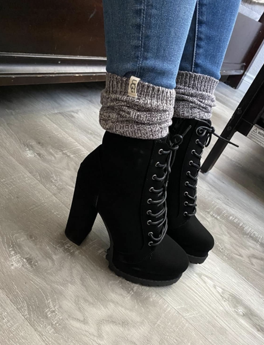 A reviewer showcases Ugg socks paired with cozy booties.