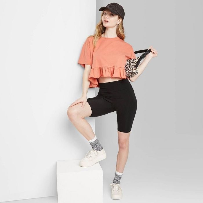 Model wearing the black high-rise bike shorts