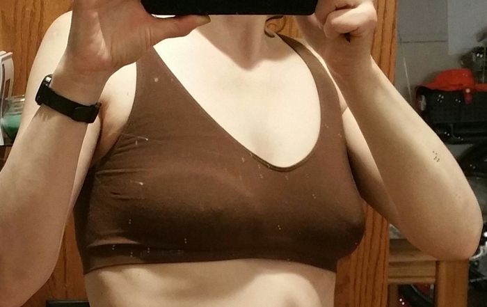 reviewer capturing a mirror selfie while wearing the bra