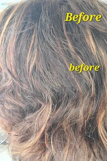 a reviewer displaying their hair's appearance before applying the air-dry curl cream
