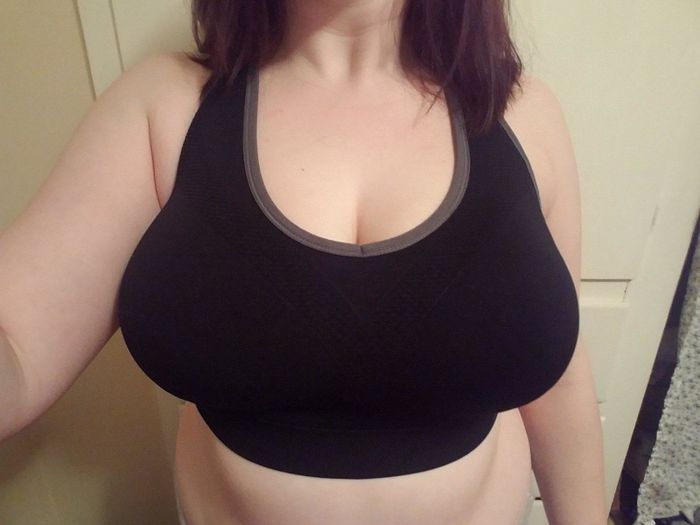 reviewer posing in a sports bra