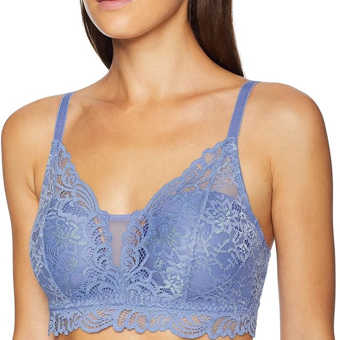 Front view of a model wearing a blue lace bralette