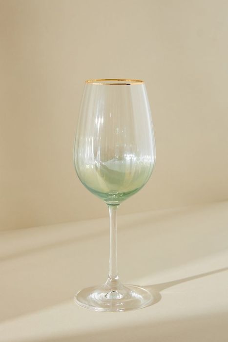 a wine glass with a gold rim