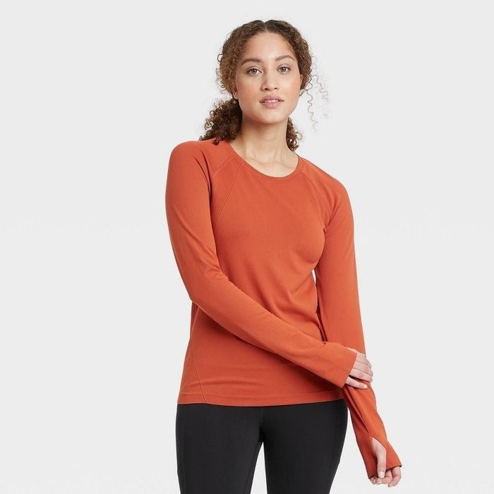 Model sporting an orange top